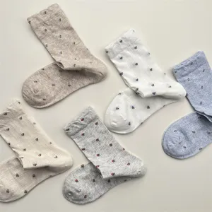 Detailed view of vintage style floral mesh mid-calf socks, breathable cotton fabric.