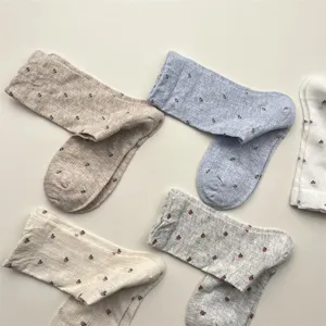Detail shot of vintage floral women crew socks, breathable mesh cotton, cute spring hosiery.
