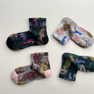 Detailed view of autumn winter retro oil painting floral and leopard embroidered mid socks.