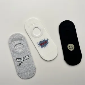 Close-up detail of breathable mesh invisible boat socks with cute cartoon letter prints.