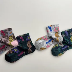 Retro oil painting style jungle botanical pattern detail, textured relief knit crew cotton socks.