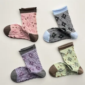 Japanese vintage relief floral socks detail, textured bubble knit, color-blocked rolled cuffs.