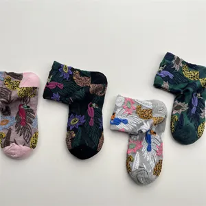 Detailed view of women's vintage oil painting style 3D relief floral pattern cotton socks.
