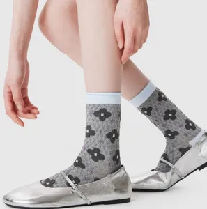 Retro floral mid-tube socks featuring a contrast rolled cuff design, soft cotton fabric detail.