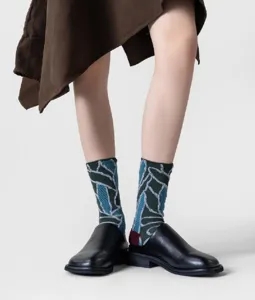 Close-up detail of women's retro vintage pattern mid-calf cotton socks with stylish textured design.