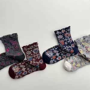 Detailed view of Japanese retro women mid-tube socks with 3D embroidered hearts and silver threads.