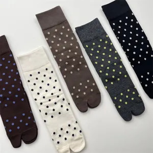Detail shot of Japanese style split toe polka dot mid tube socks, soft cotton fabric.