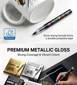 Acrylic paint marker pens with flexible brush tips for smooth writing on black cards and mugs.