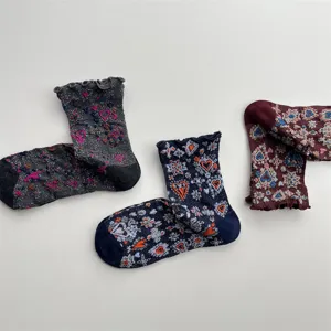 Vintage embossed heart glitter mid-tube socks with delicate ruffles for women detail view.