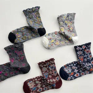 Detailed view of Japanese retro embossed heart silver thread women mid-calf socks with ruffles.
