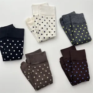 Close up of Japanese style split toe socks with cute polka dot patterns and soft texture.