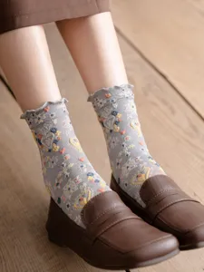 Japanese retro ruffles mid-tube socks with embossed hearts and silver silk details.
