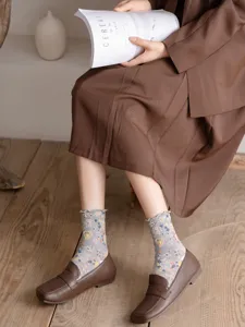 Japanese vintage style cotton mid-tube socks with 3D embossed hearts and lettuce edge.
