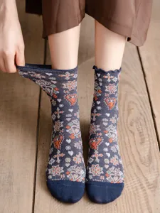 Detailed close-up of retro Japanese style vintage floral mid-tube socks with glitter metallic thread.