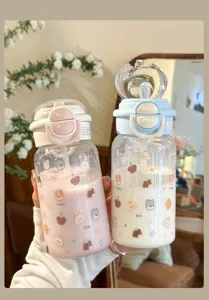 Cute plastic water bottle with straw and dual drinking lid, portable student cup detail.
