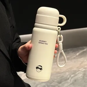 Stainless steel insulated water bottle detail shot, dual-drink portable cup with cute print and strap.