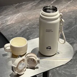 Dual-drink 304 stainless steel insulated water bottle with straw and cup, portable design.