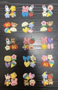 Detailed view of assorted 3d resin cartoon charms, perfect for diy phone cases and cup decor.
