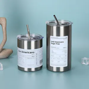 Stainless steel tumbler detail, vacuum insulated coffee cup with metal straw, modern design detail.