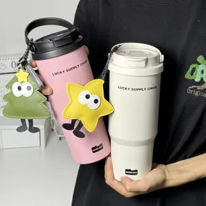 Large capacity stainless steel travel tumbler with cute hanging charms for daily use.