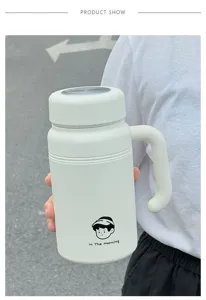 Minimalist stainless steel insulated water bottle with handle and tea infuser for office.
