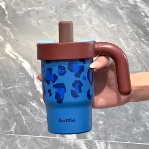 Stainless steel insulated tumbler with straw and handle, cute blue leopard print water bottle.