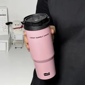 Detail view of pink stainless steel insulated tumbler with dual-drink lid and portable handle.