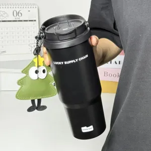 Large capacity stainless steel travel tumbler with dual-drink lid and cute pendant detail.