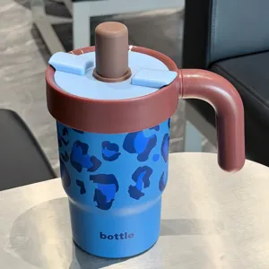 Portable stainless steel tumbler with straw and handle, cute leopard print insulated water cup.