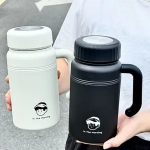 Stainless steel insulated travel mug with portable handle and lid for office and use.