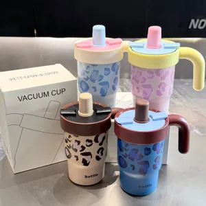 Stainless steel vacuum insulated tumbler with straw lid, handle and trendy leopard print.