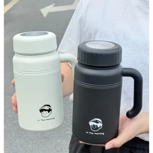 Portable stainless steel thermos water bottle with convenient handle for daily office use.