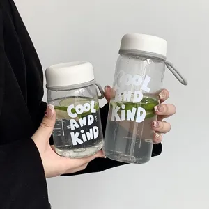 Portable clear plastic water bottle with white lid and cute letter print for daily use.