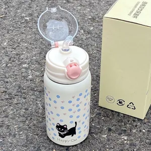 Detailed close-up view of cute cat stainless steel thermos straw cup with lovely bow patterns.