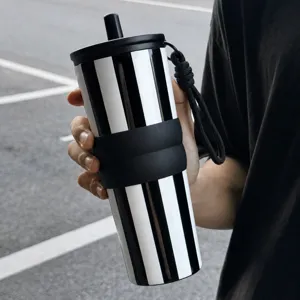 Stainless steel insulated tumbler with straw and strap, black and white striped travel mug.