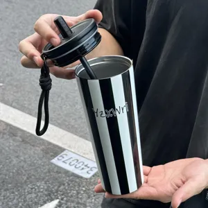 Stainless steel vacuum insulated tumbler with straw and lanyard, black and white striped design