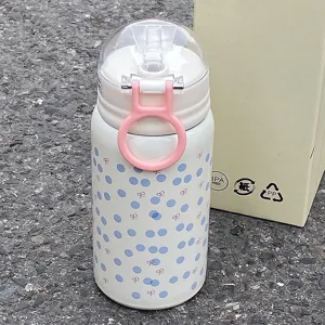 Cute stainless steel thermos water bottle with polka dots, straw and portable ring.