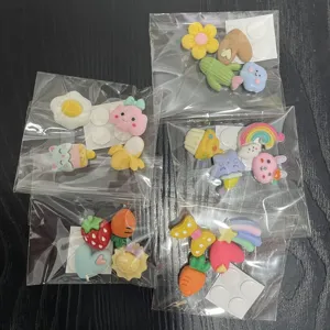Detailed view of colorful 3D resin cartoon flatback charms set, perfect for DIY phone case decor.