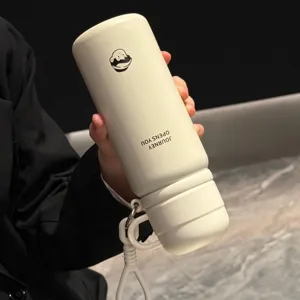 Detail view of portable insulated water bottle with double lid and straw design for daily use.