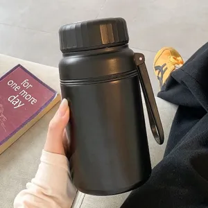 Large capacity stainless steel thermos bottle detail view, portable matte black water bottle.