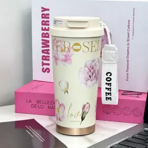 Floral insulated coffee tumbler with handle strap, elegant camellia design for women.