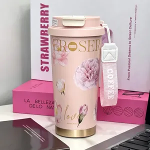 Pink floral stainless steel insulated travel mug with straw and carrying strap for women.