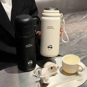 Stainless steel vacuum flask detail showing dual-drink lid, straw, and portable design.