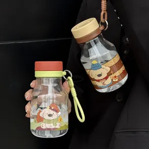 Detailed view of portable cute cartoon water bottles with lanyards and cute puppy prints.