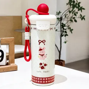 Insulated stainless steel water bottle with cute rabbit cartoon, 600ml portable travel cup.
