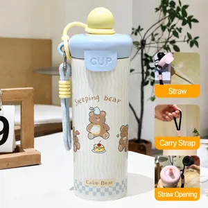 Cute cartoon stainless steel insulated water bottle detail view with straw and lanyard.