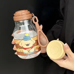 Cute cartoon straw water bottle detail, clear plastic cup featuring puppy design and strap.