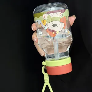 Cute cartoon straw water cup for kids and students, portable transparent bottle with strap.