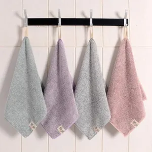 Detailed view of hanging microfiber hand towels with loops, soft texture for kitchen and bathroom.