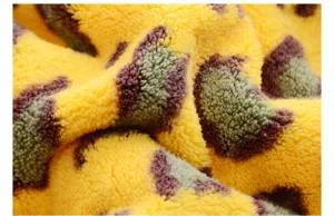 Coral fleece leopard print dry hair towel fabric detail, super absorbent soft plush material.